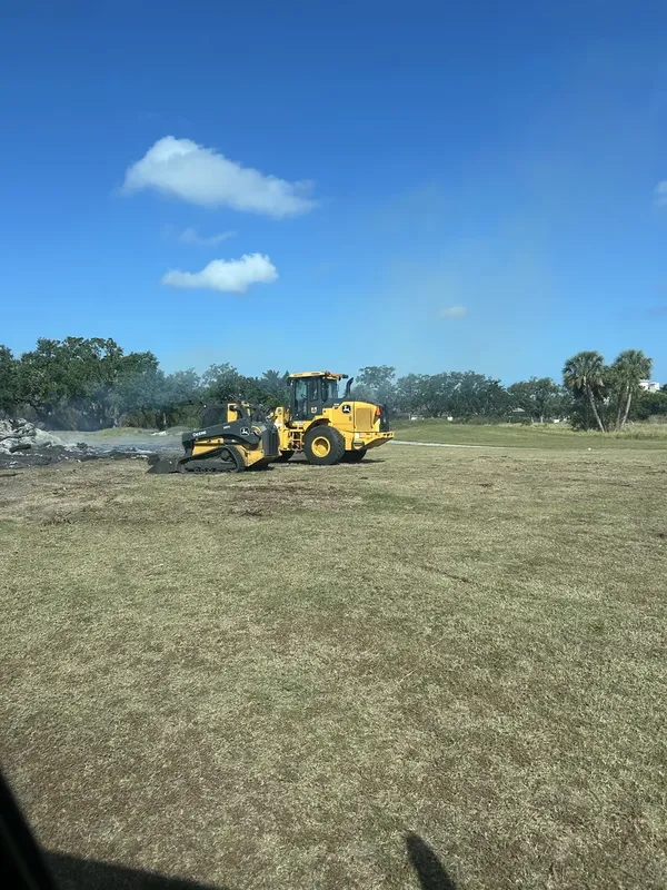 John Deere compact track loader and wheel loader on open grading site in Bradenton FL