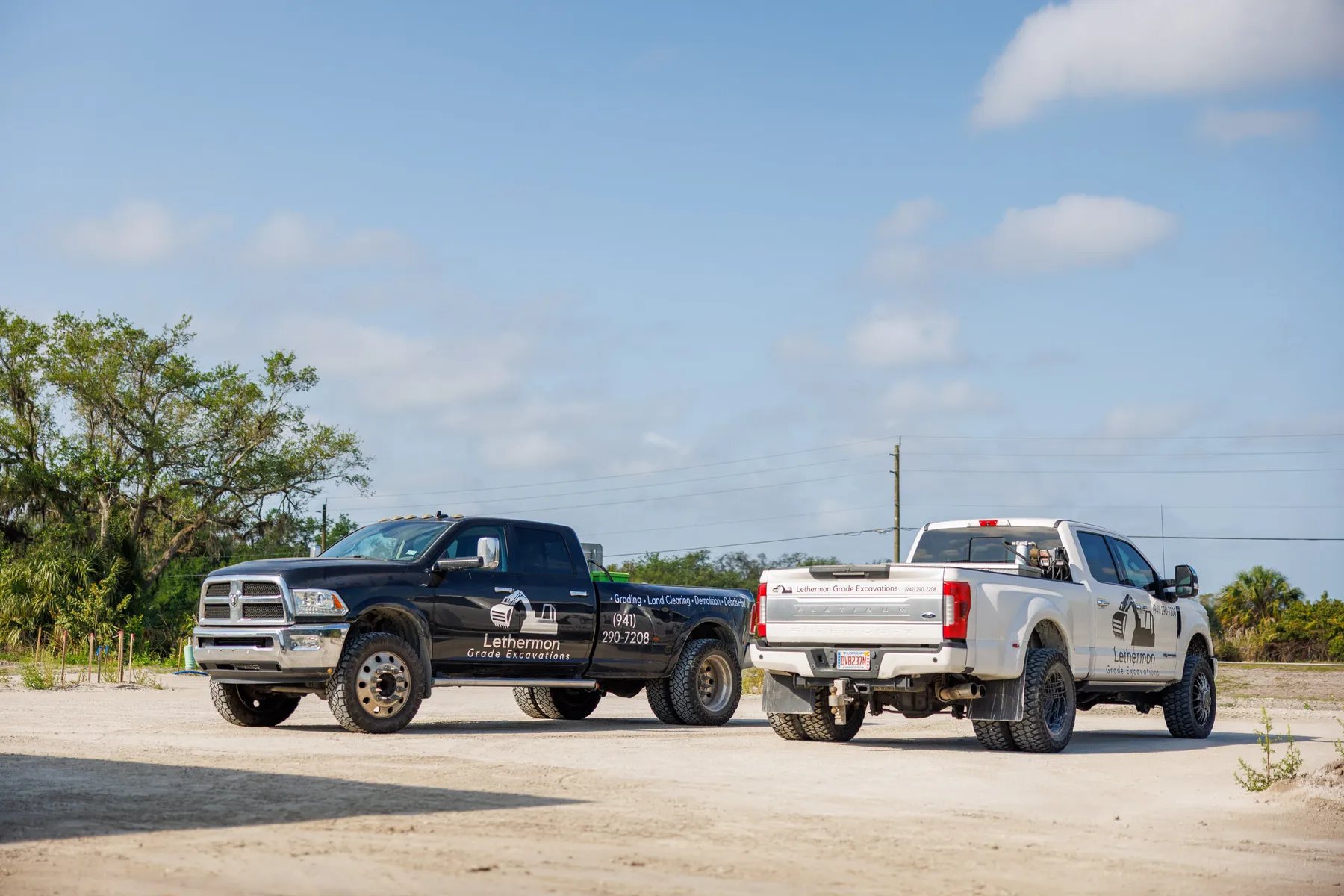Lethermon Grade Excavations branded truck fleet in Bradenton FL — grading, land clearing, demolition, and debris hauling